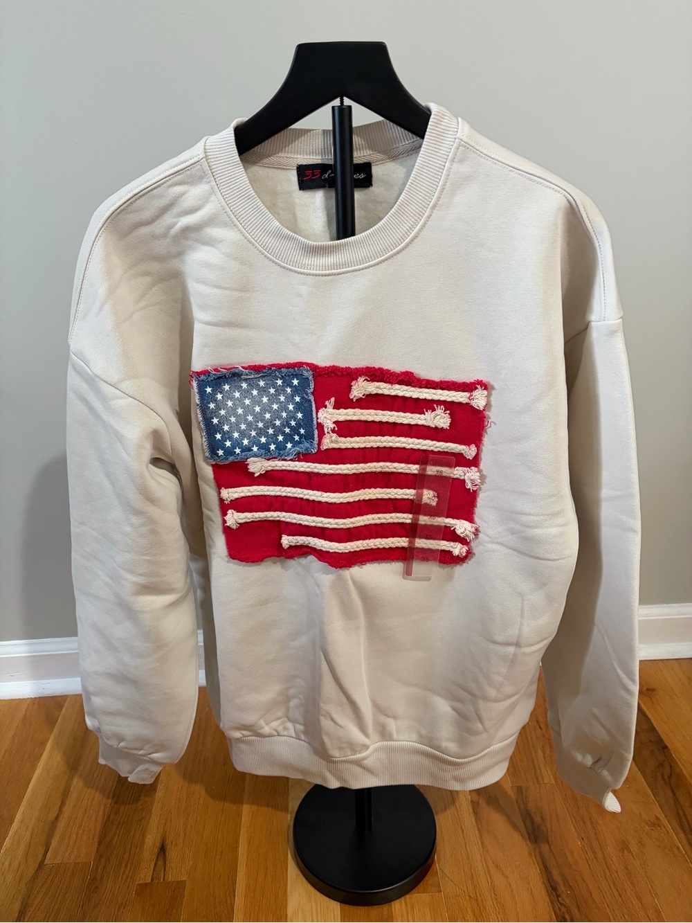 32 Degrees Cream Crewneck Sweatshirt with Red and Blue Flag Patch